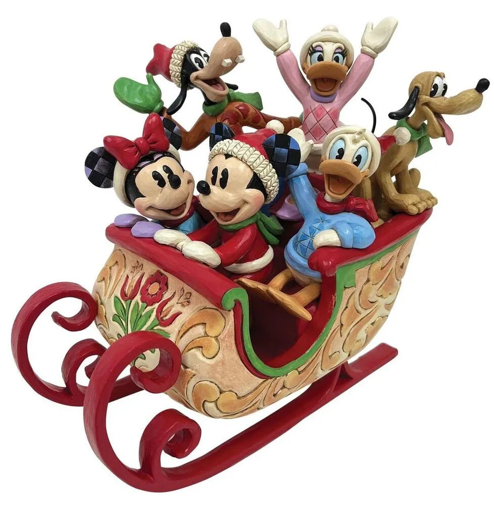 Mickey, Minnie, Goofy, Donald, Daisy, and Pluto in a scrollwork-detailed red Christmas sleigh figurine by Jim Shore