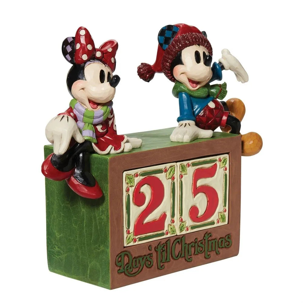 Close front view of Mickey and Minnie Mouse Christmas figurines flanking a two-tile "Days 'til Christmas" countdown block.