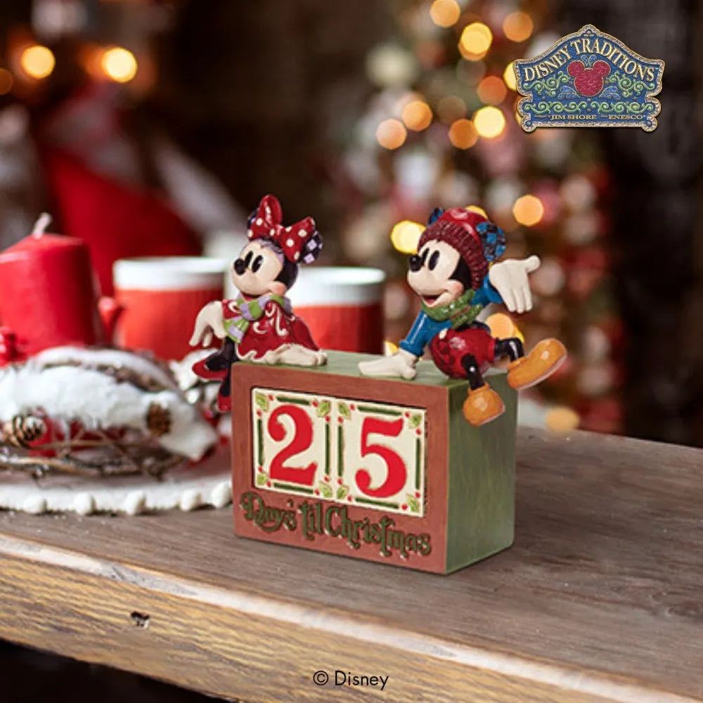 Disney Traditions Mickey and Minnie Mouse "Days 'til Christmas" countdown figurine styled on a mantle in a festive holiday setting.