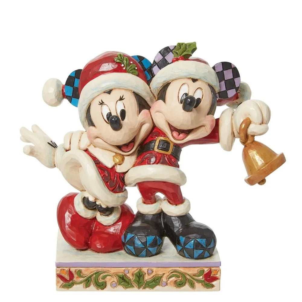 Front view of Mickey and Minnie Mouse Santa figurines with holly-trimmed hats, embracing as Mickey holds a gold bell.