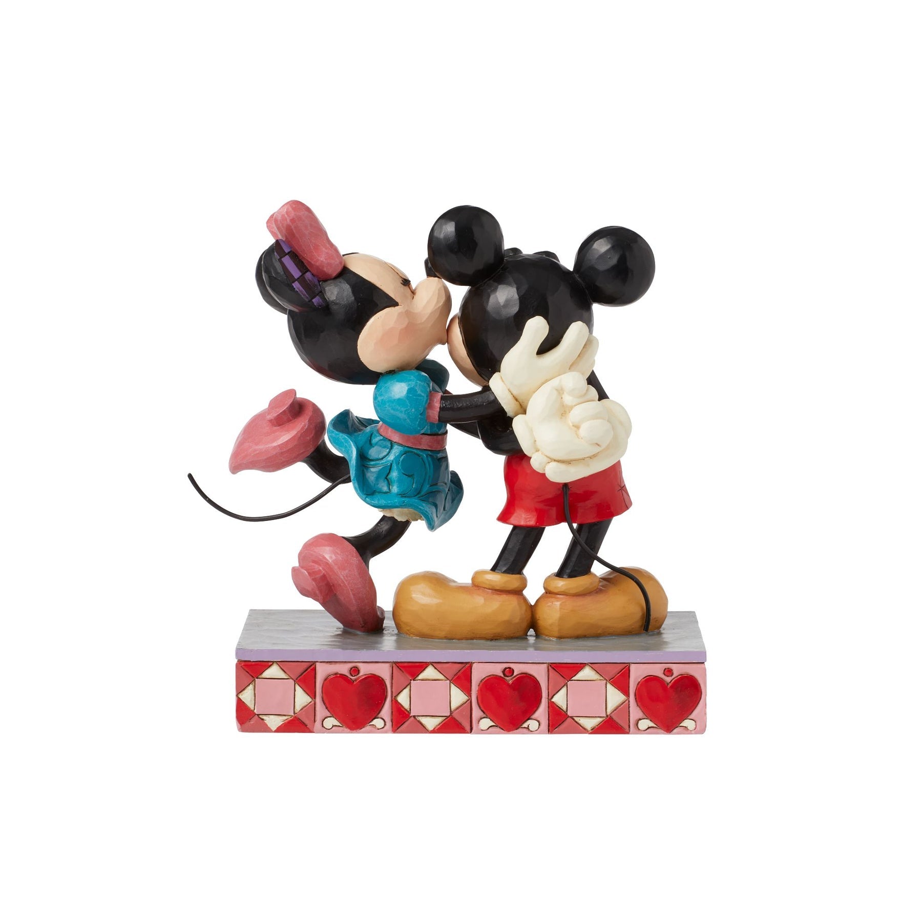 Rear view of Mickey and Minnie Mouse embracing figurine, Minnie holding a heart, heart-patterned painted base