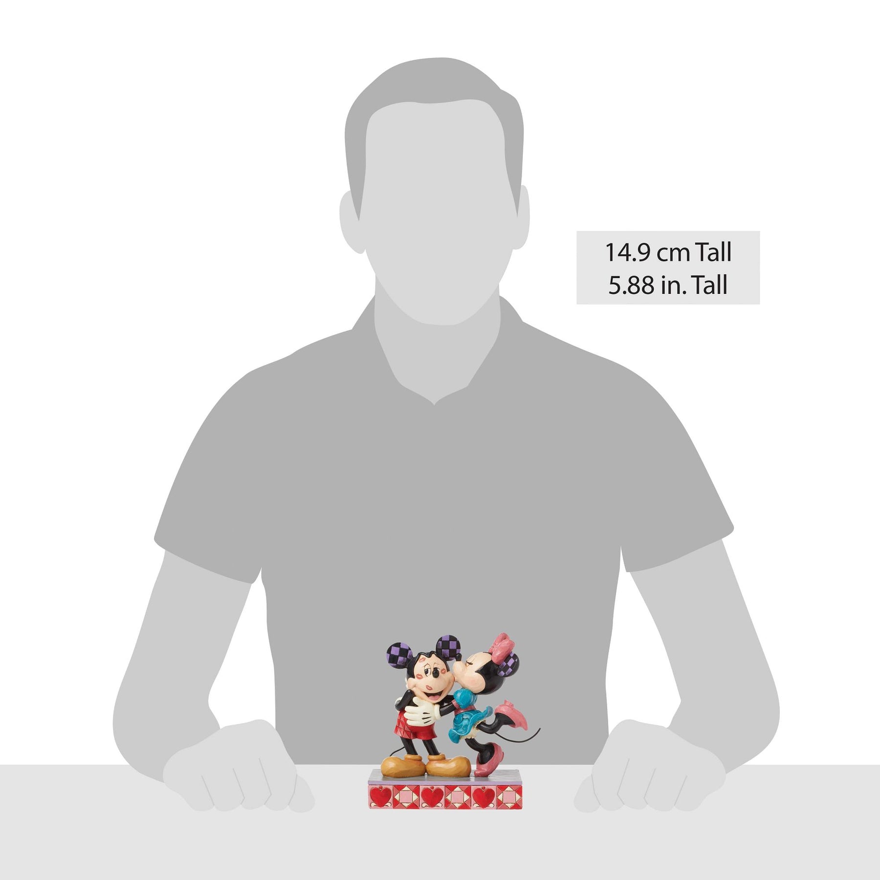 
Mickey and Minnie Mouse kissing figurine size comparison with adult male silhouette, 14.9cm / 5.88 inches tall