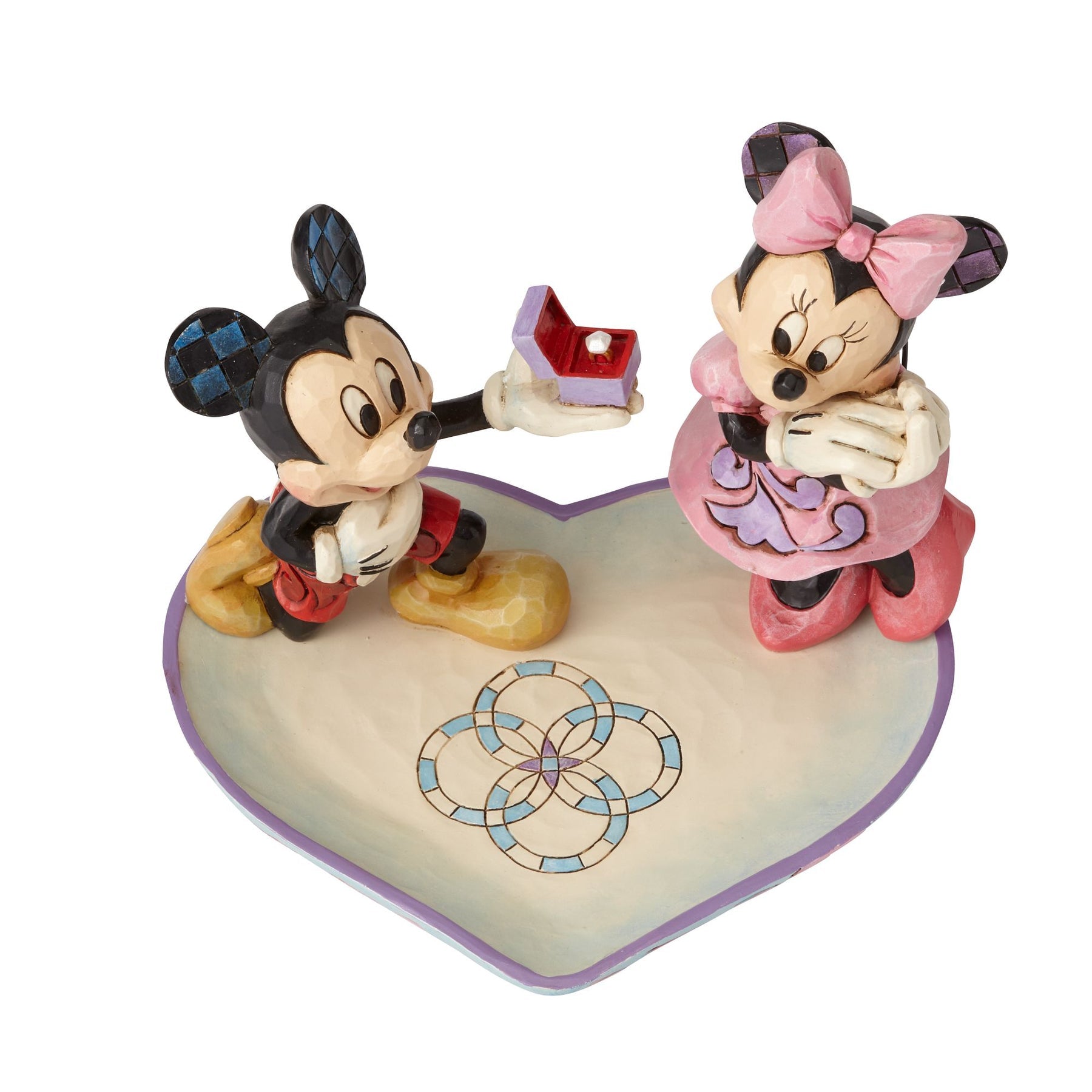 Mickey Mouse proposing to Minnie with a ring box figurine on a heart-shaped base with interlocking rings detail 