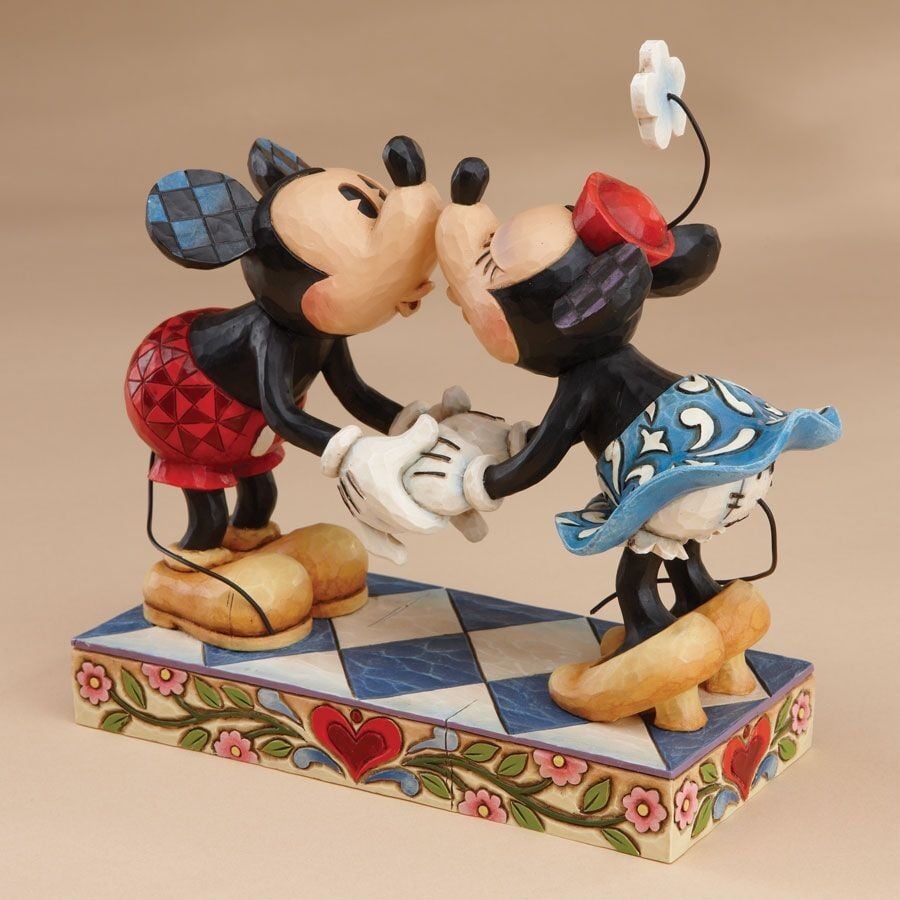 Mickey and Minnie Mouse kissing figurine, front angle, holding hands on a heart and floral painted base