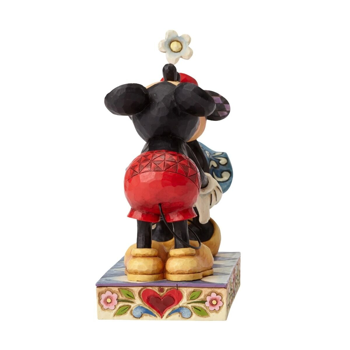 Mickey and Minnie Mouse kissing figurine rear view, showing geometric detailing on outfits and heart floral painted base