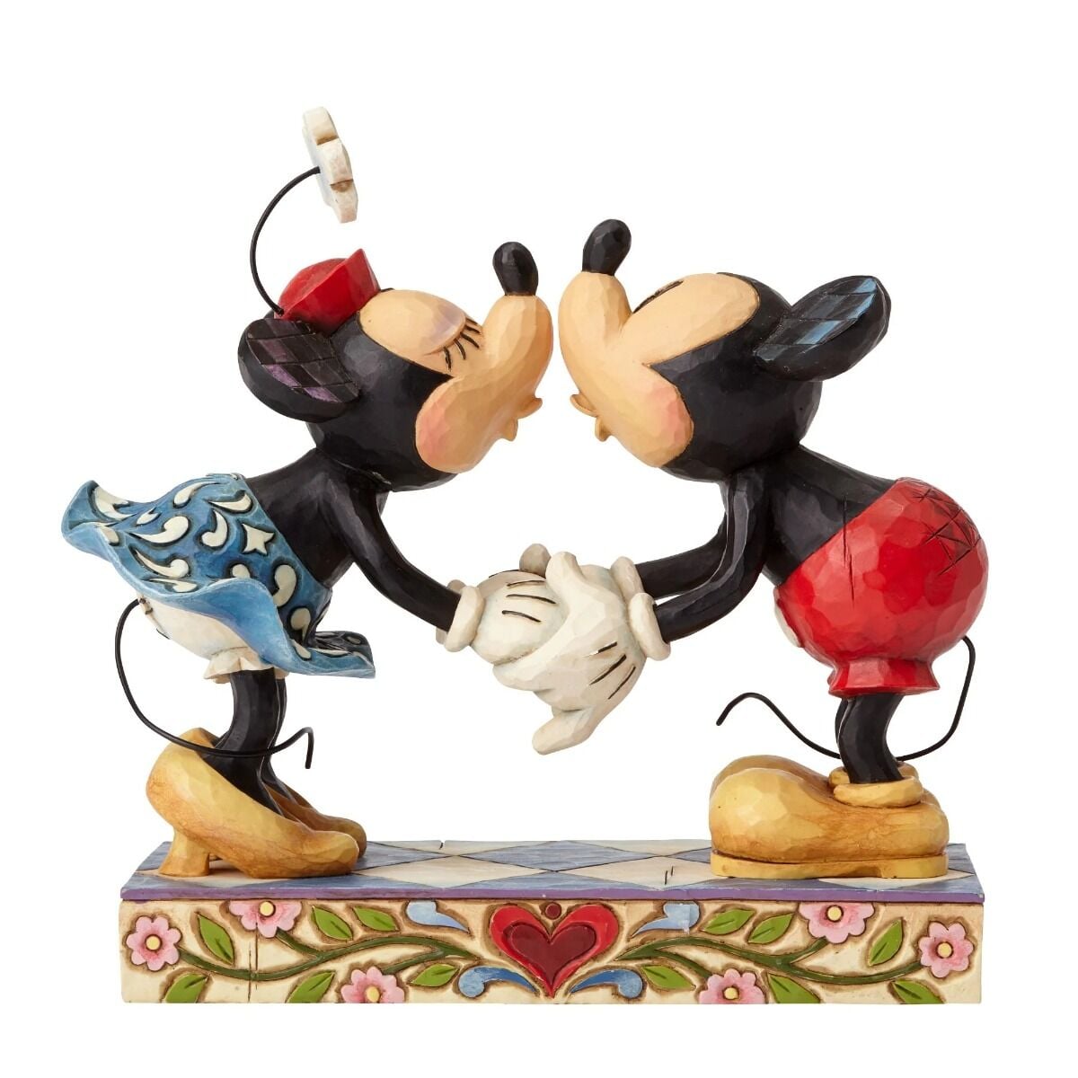 Mickey and Minnie Mouse figurine facing each other about to kiss, hands clasped, on a heart and floral painted base