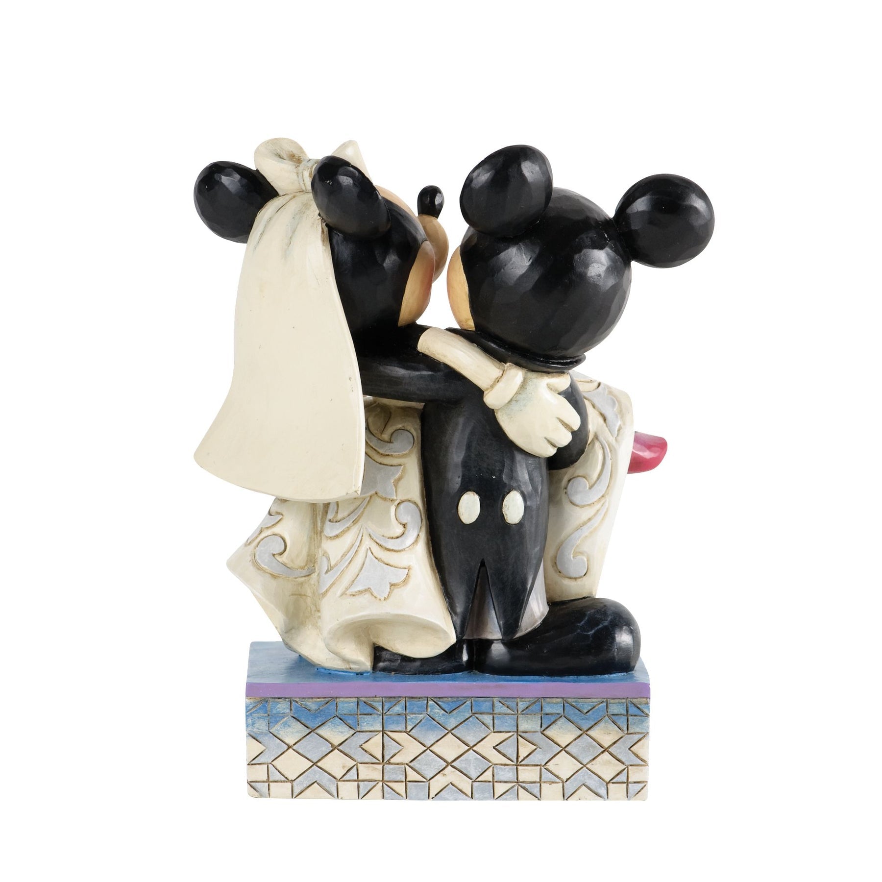 Mickey and Minnie Mouse wedding figurine rear view, showing Minnie's veil and scrollwork gown detail on a geometric patterned base