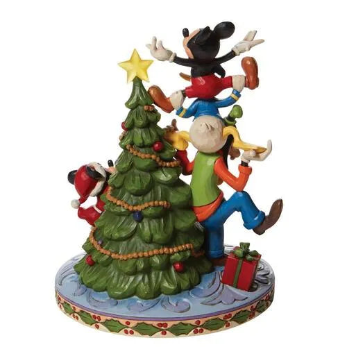 Rear view of Disney Fab Five Christmas tree figurine, characters decorating a star-topped tree with gifts on a holly base.
