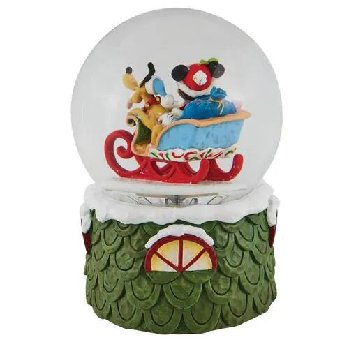Opposite side view of a Mickey Mouse and Pluto Christmas snow globe, sleigh scene inside, green scaled base with window.