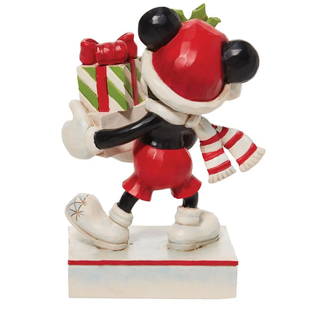 Rear view of Mickey Mouse Christmas figurine showing Santa hat, striped scarf, and gift stack