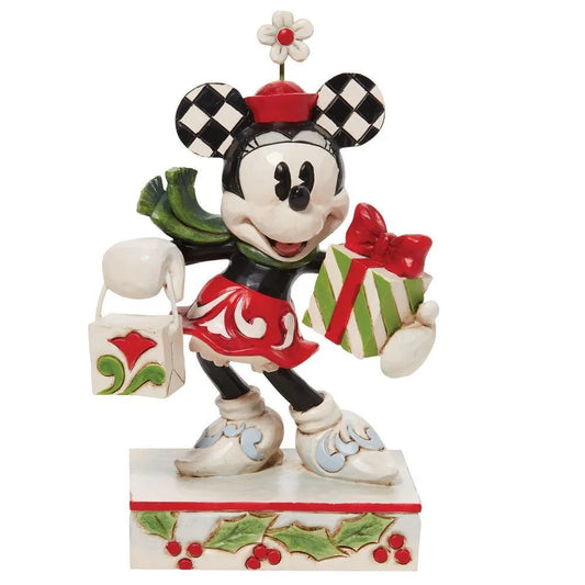 Minnie Mouse figurine front view; checkered ears, flower hat, green scarf, striped gift with red bow and holly-detailed shopping bag