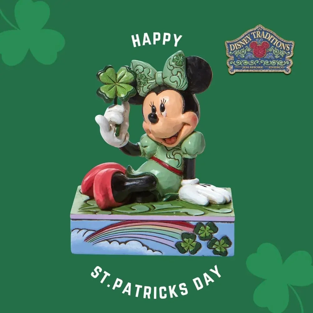 Minnie Mouse St. Patrick's Day figurine in green outfit holding a four-leaf clover, on a rainbow and shamrock painted base