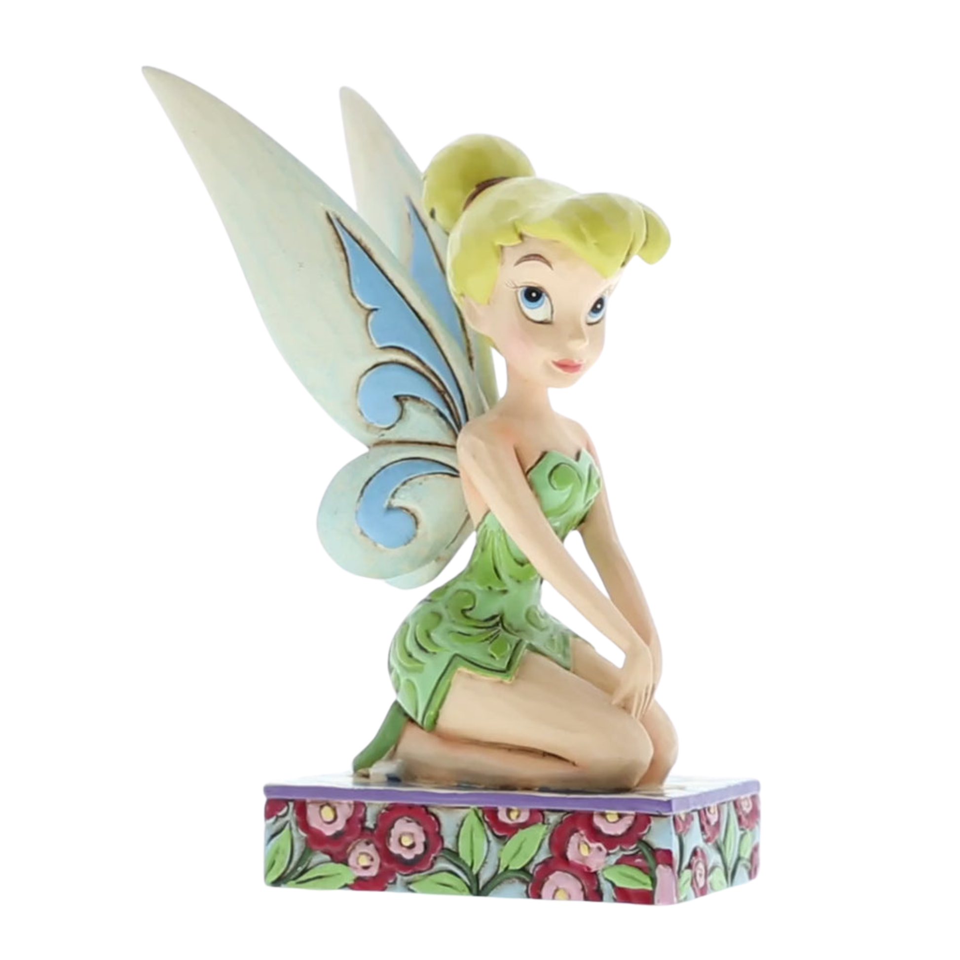 Tinker Bell figurine angled left view, seated with hands on knees, green scrollwork dress, blue-accent wings, on a red floral base
