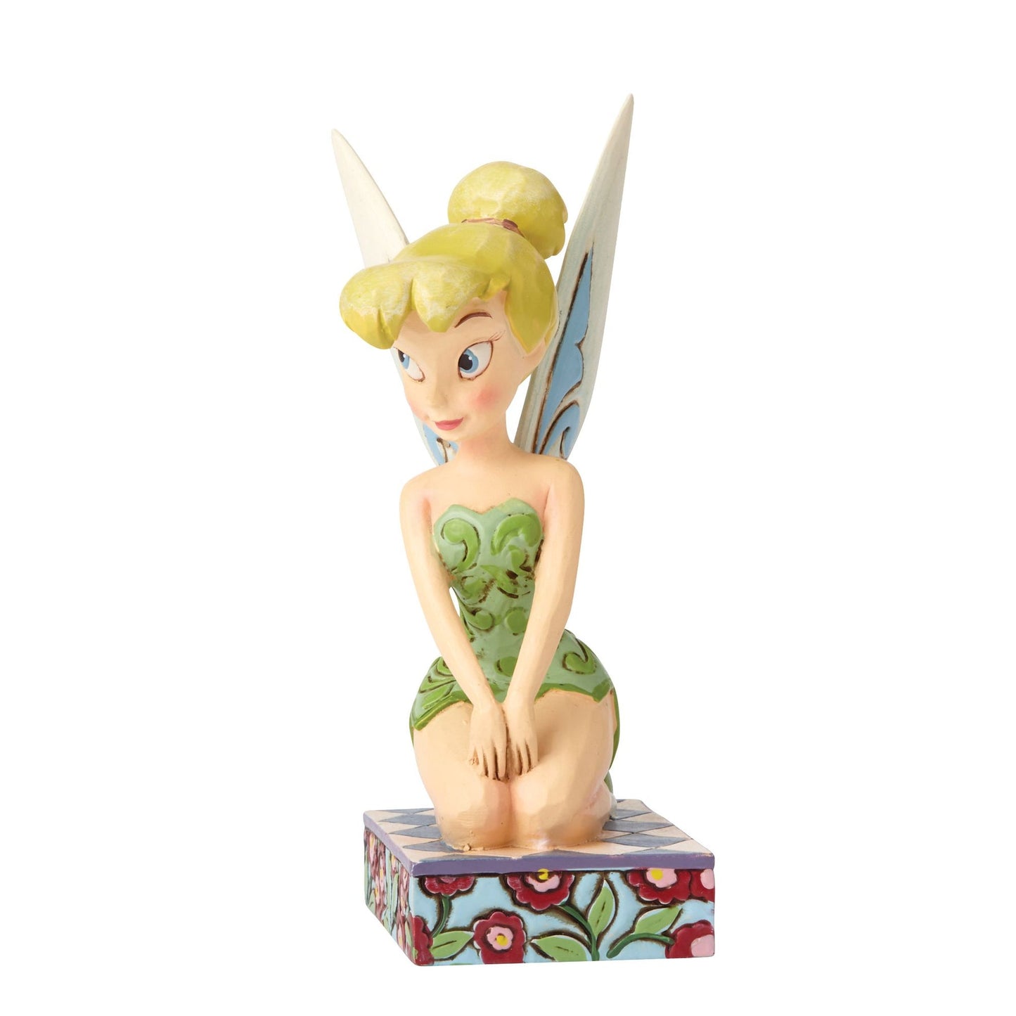 Tinker Bell figurine seated pose, right view, green scrollwork dress, blue-tipped wings, on a painted floral base 