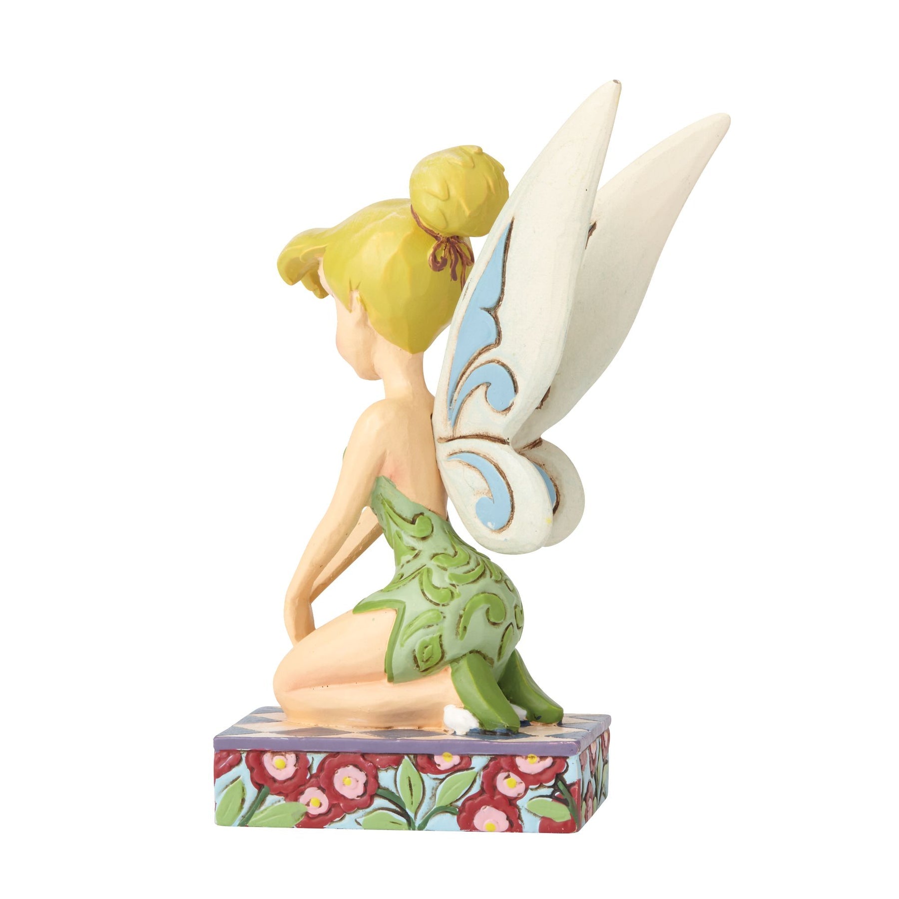 Tinker Bell figurine side view showing blue scrollwork wings, green dress with vine detailing, and floral painted base