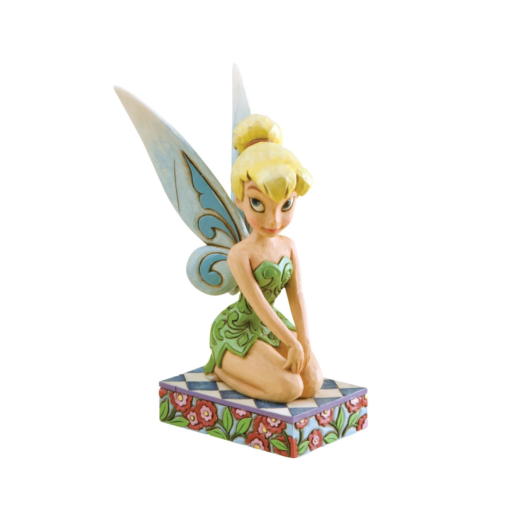 Tinker Bell figurine front view, seated with hands on knees, green scrollwork dress, blue-accent wings, on a red floral base