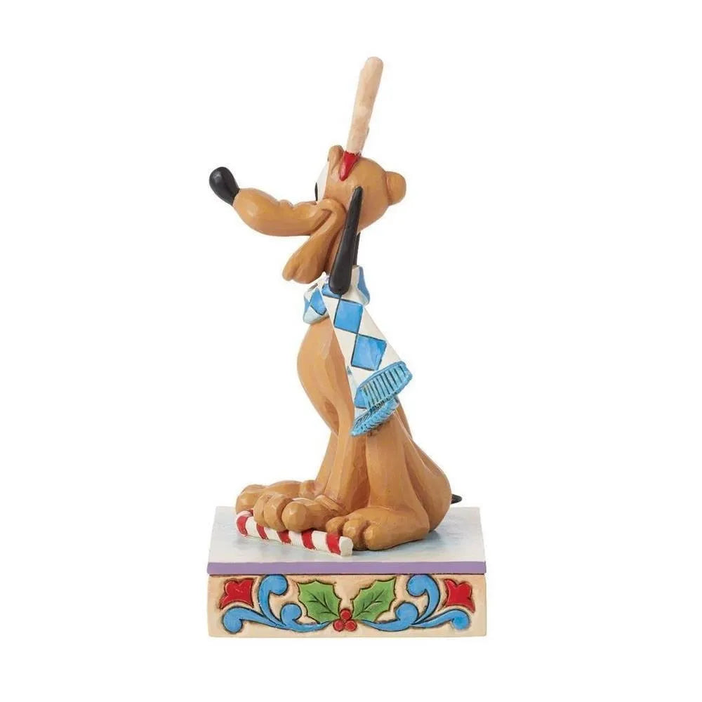 Opposite side view of a Pluto Christmas figurine with reindeer antlers and argyle scarf, on a holly and scrollwork base.