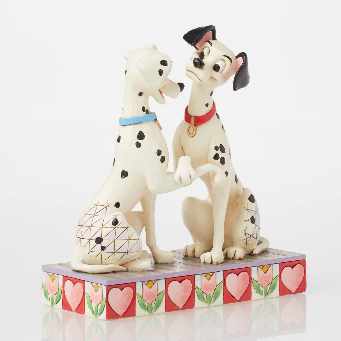Pongo and Perdita figurine from 101 Dalmatians facing each other with paws touching, red and blue collars, heart base