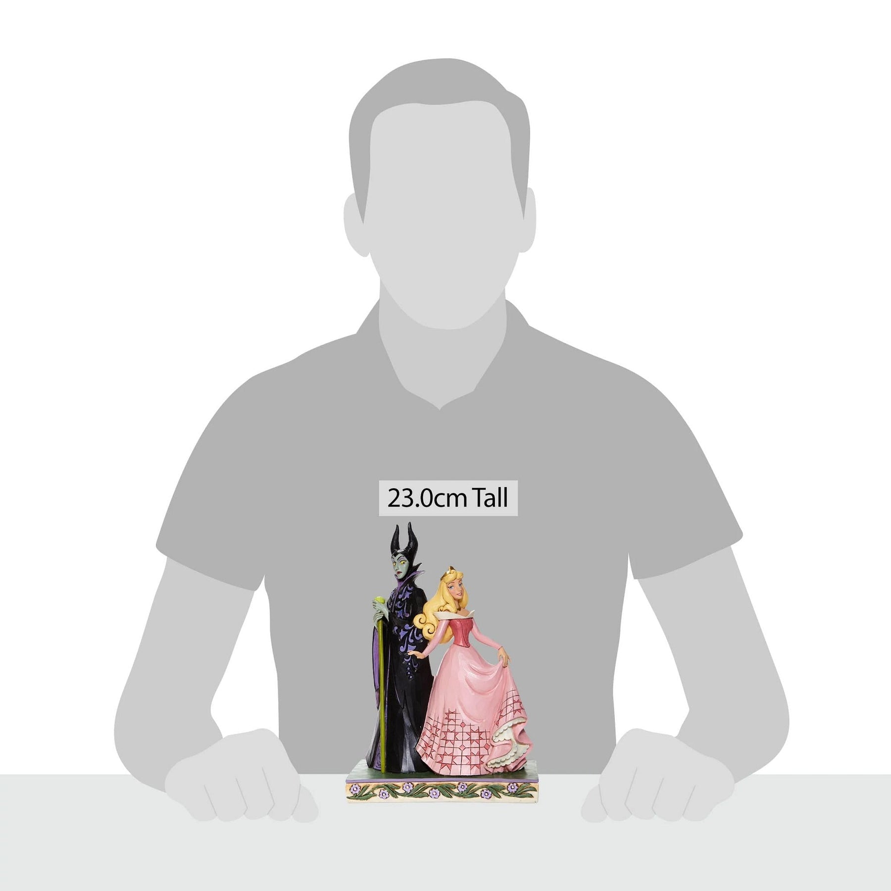 Aurora and Maleficent figurine shown against human silhouette for scale, measuring 23.0cm tall