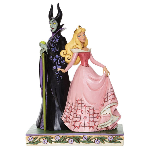 Aurora in pink gown and Maleficent with staff and orb figurine, front three-quarter view, on floral decorated base
