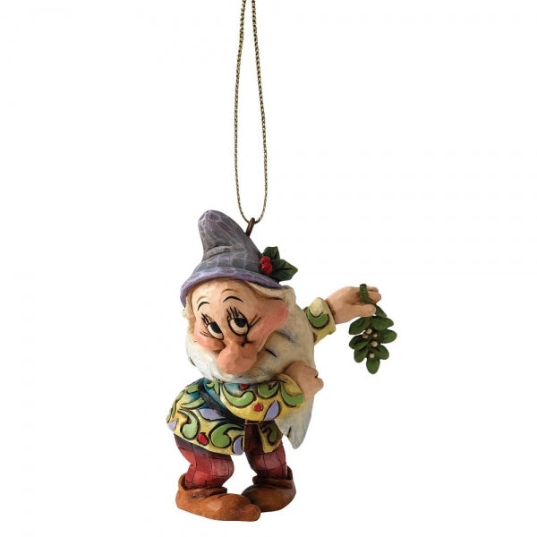 Bashful dwarf hanging ornament with folk art detailing, holding mistletoe, in colourful patterned coat and grey hat with holly