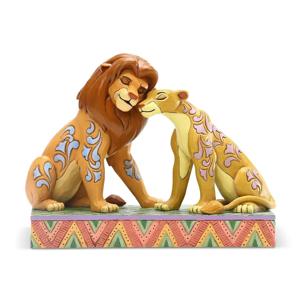 Simba and Nala Lion King figurine nuzzling together, blue and pink scrollwork body details, on a chevron painted base