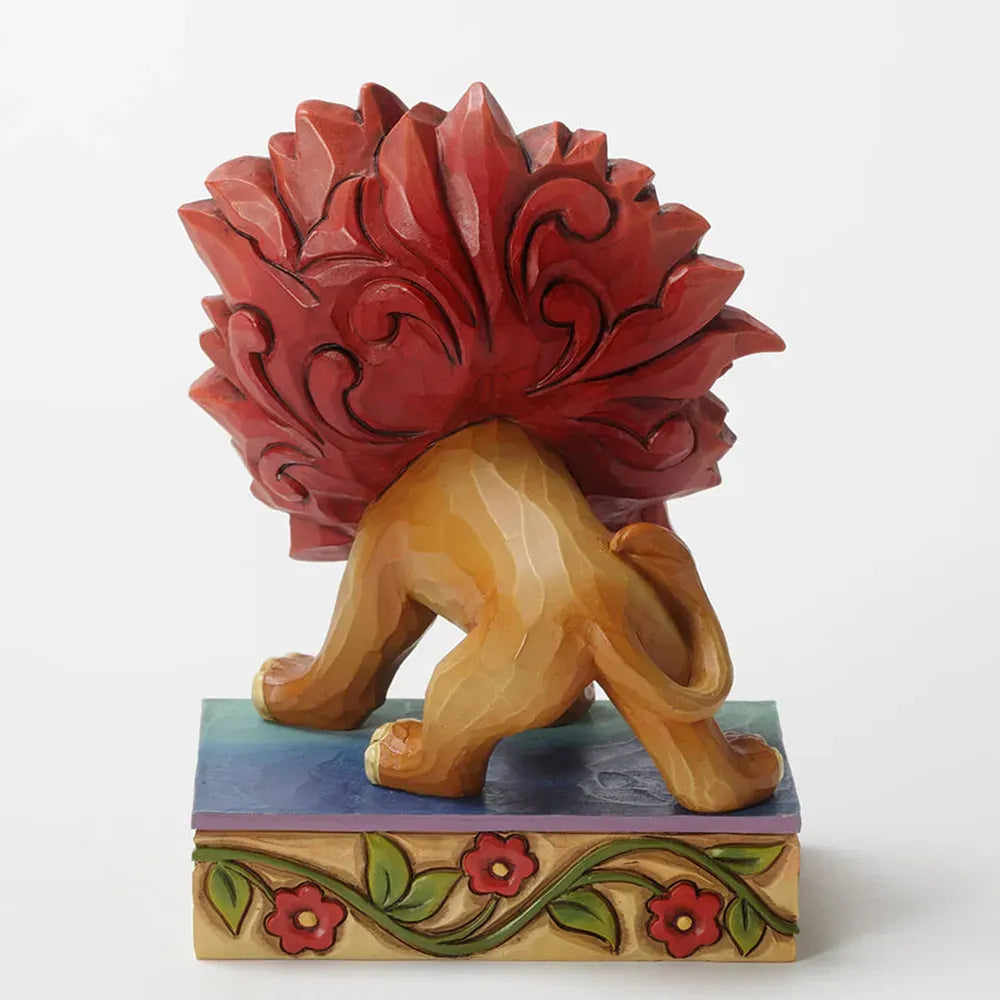 Young Simba Lion King figurine front angled view, crouching with large red scrollwork mane and smiling expression, on floral vine base