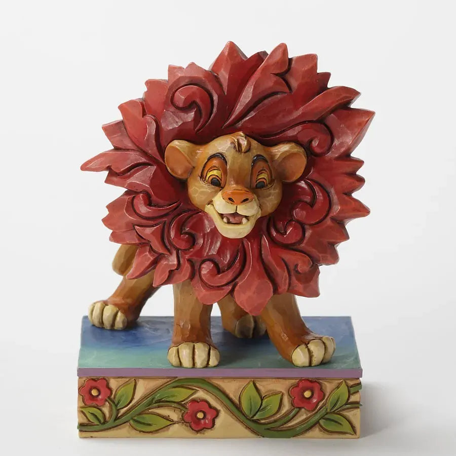 Young Simba from The Lion King figurine with oversized red scrollwork mane, playful pose on a painted floral vine base