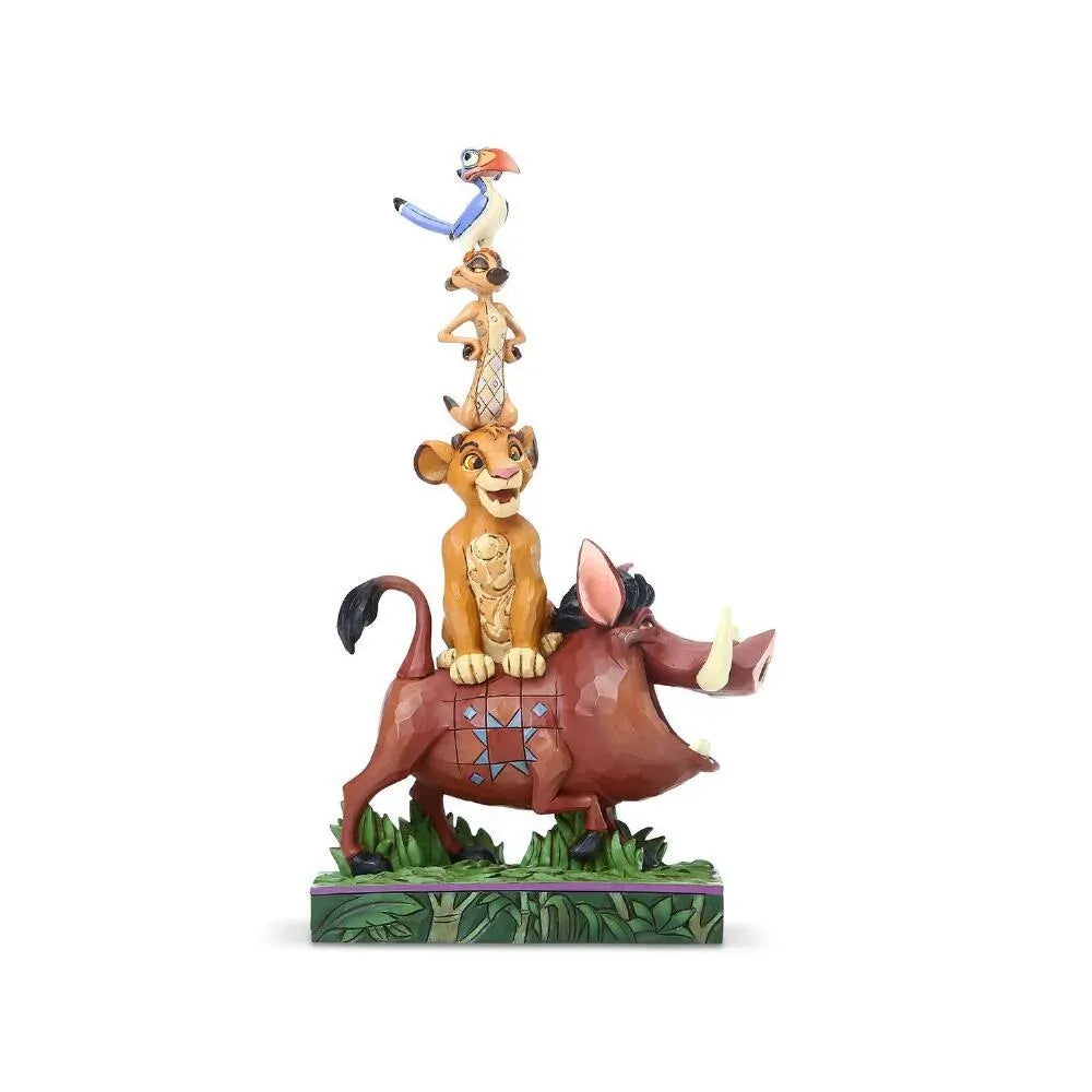 Lion King stacked figurine with Pumbaa at the base, young Simba, Timon, and Zazu balanced on top, on a jungle leaf painted base 