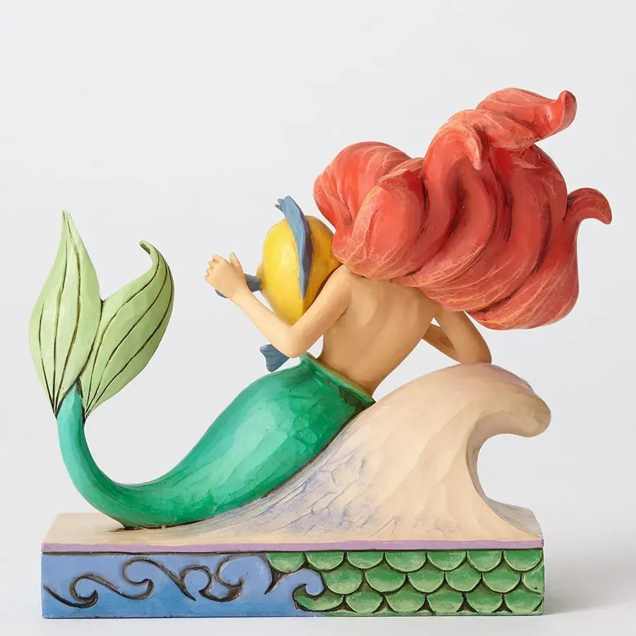 Ariel and Flounder Little Mermaid figurine rear view showing green tail, flowing red hair, and wave and scale painted base