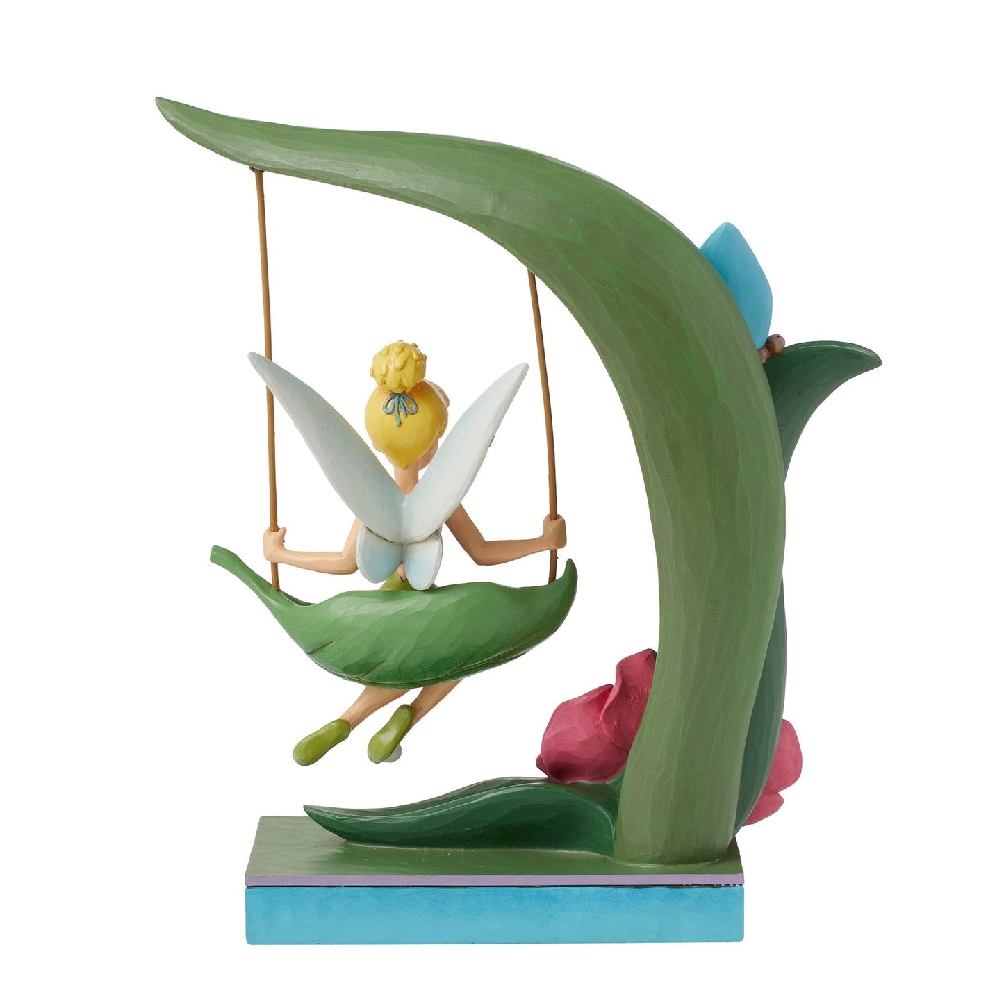 Rear view of Tinker Bell figurine on a leaf swing suspended from a curved green stem, pink flower detail