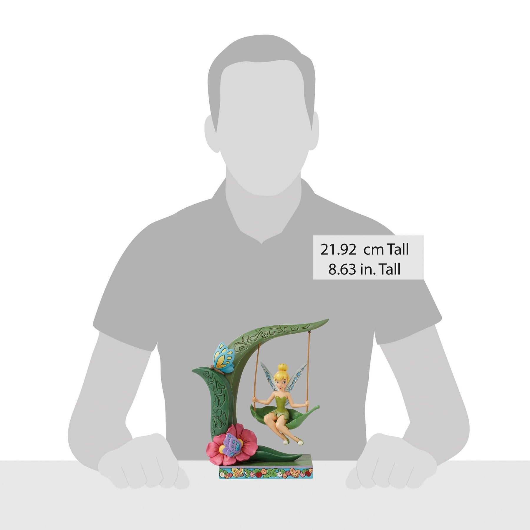 Tinker Bell on leaf swing figurine size comparison with adult male silhouette, 21.92cm / 8.63 inches tall