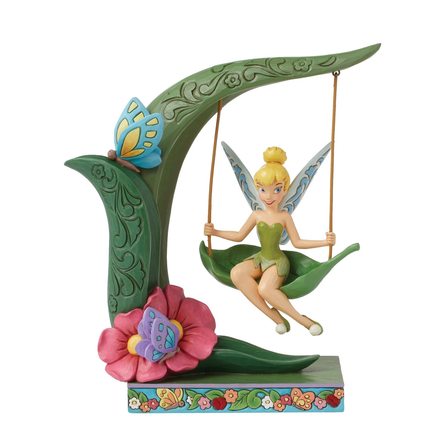 Tinker Bell figurine seated on a leaf swing from a curved stem, blue butterfly, pink flower, floral painted base