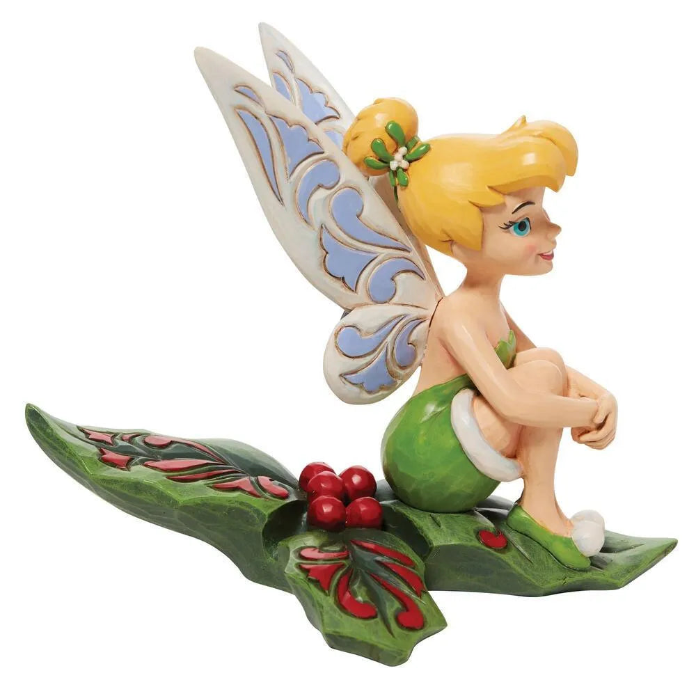 Side profile of Tinker Bell figurine on holly leaf base with red berries and scrollwork detail, mistletoe hair clip