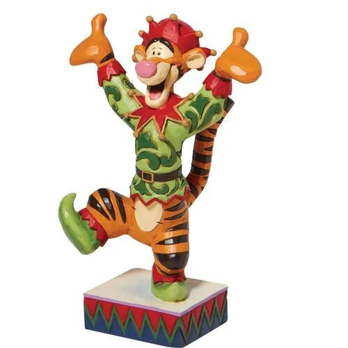 Angled front view of Tigger Christmas elf figurine, mid-bounce pose with arms up and leg raised, on a zigzag base