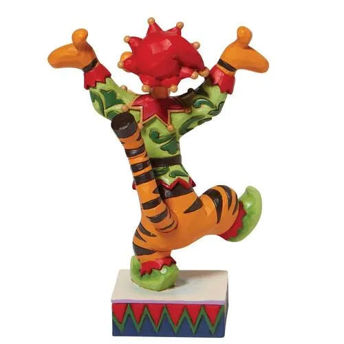 Rear view of Tigger Christmas elf figurine, arms raised and one leg kicked up, on a colourful zigzag-patterned base
