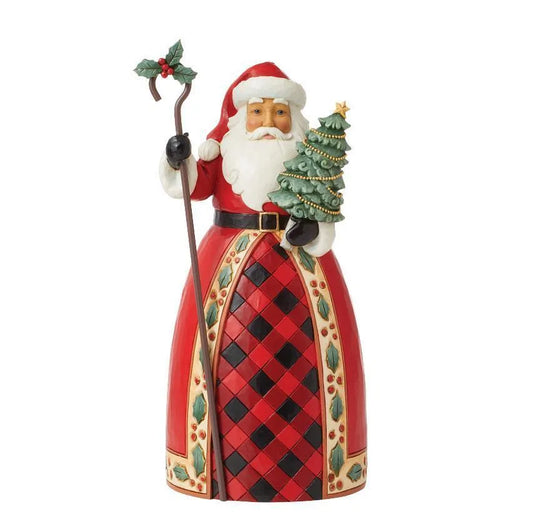 Front view of Santa figurine in red and black plaid robe with holly border, holding a Christmas tree and holly-topped staff