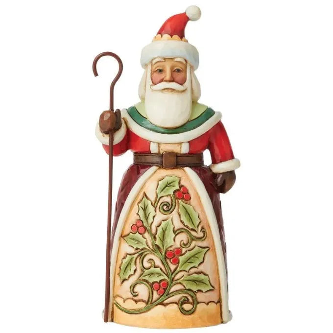 Front view of a Santa figurine holding a shepherd's crook, robe featuring sculpted holly and berry motif with scrollwork. 