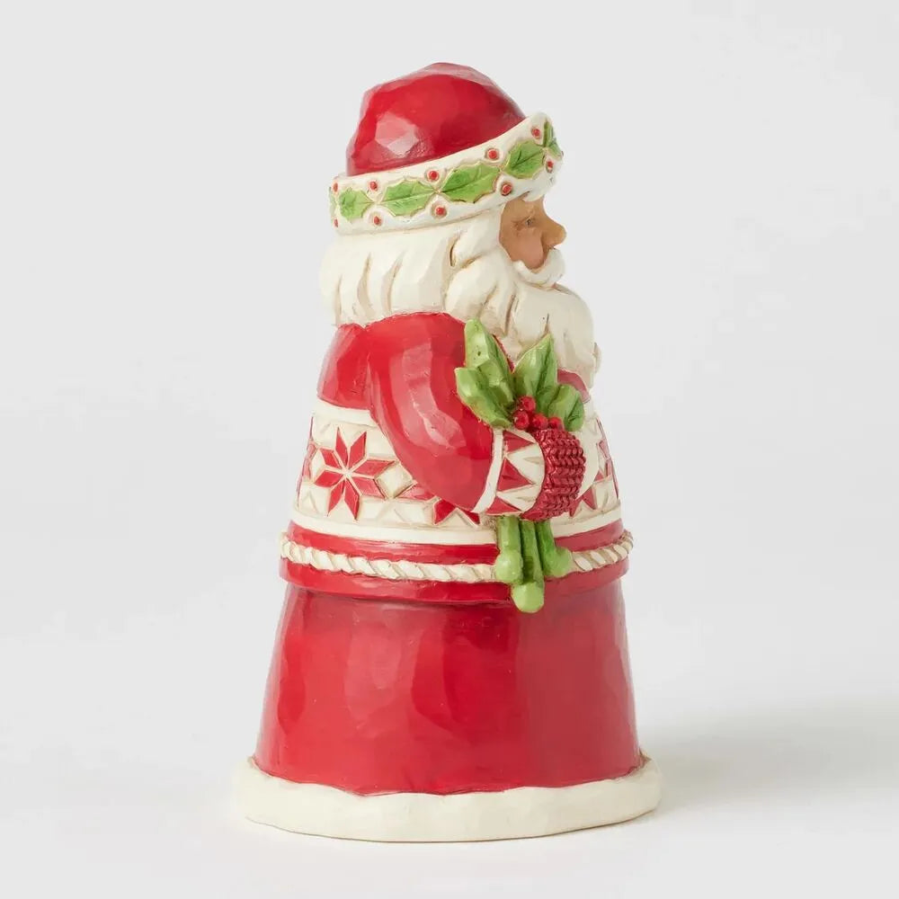 Left side view of Santa figurine holding holly, showing snowflake mid-band, holly-trimmed hat, and tapered red coat