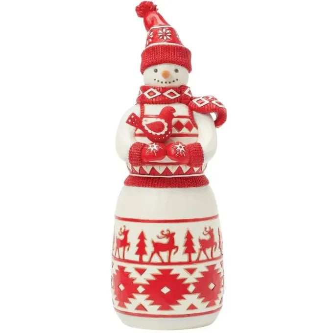Nordic snowman figurine in red pom-pom hat and scarf, holding a red bird, Fair Isle skirt with reindeer and geometric patterns