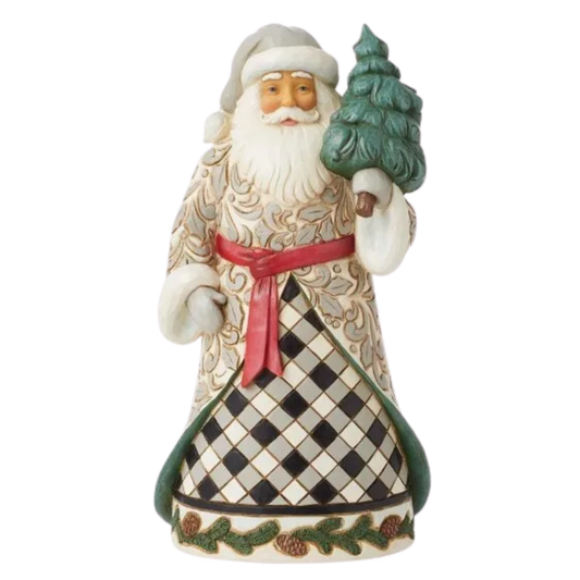 Angled front view of a Jim Shore Santa figurine holding a green tree, wearing a scrollwork robe over a black and white checked skirt.