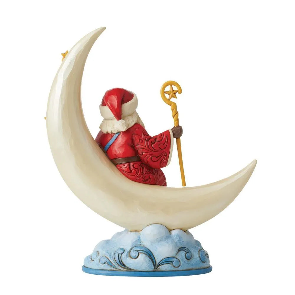 Rear view of Santa figurine seated on a crescent moon, holding a gold star-topped staff, cloud-detailed base