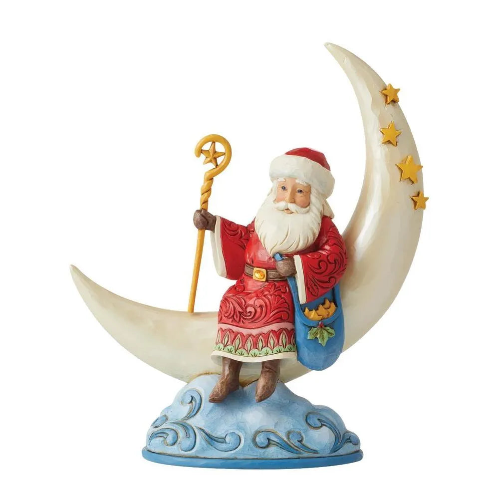 Front view of Santa figurine seated on a crescent moon with gold stars, holding a star-topped staff and blue holly bag