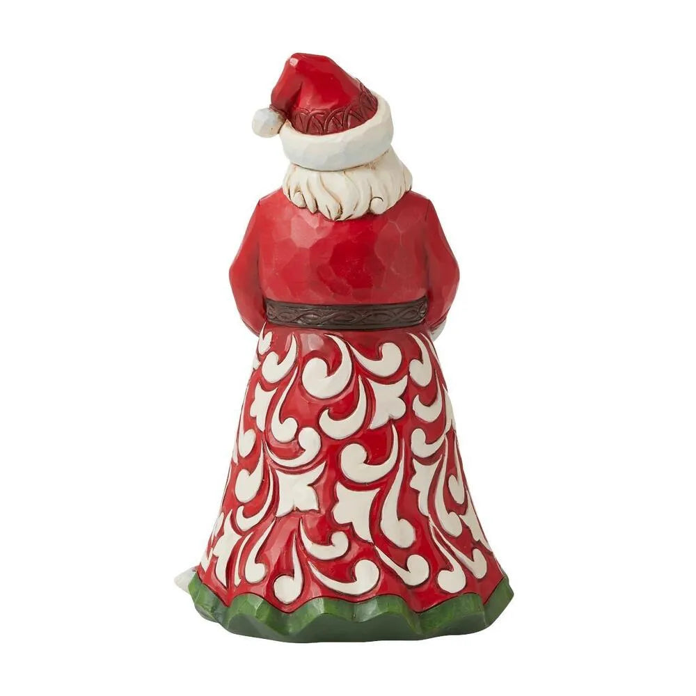 Rear view of Santa figurine showing red robe with white scrollwork detailing and green hem trim 