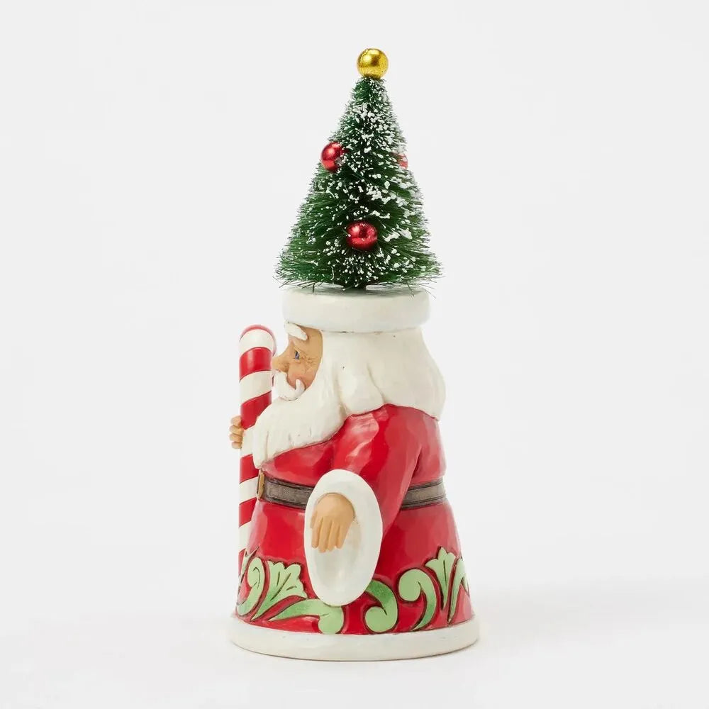 Right side view of Santa gnome figurine with decorated bottle brush tree hat, candy cane staff, red robe with green holly detail