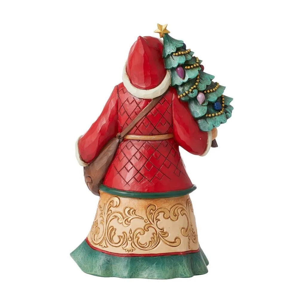 Rear view of Santa figurine in red diamond-patterned coat carrying a decorated Christmas tree and satchel, gold scrollwork robe