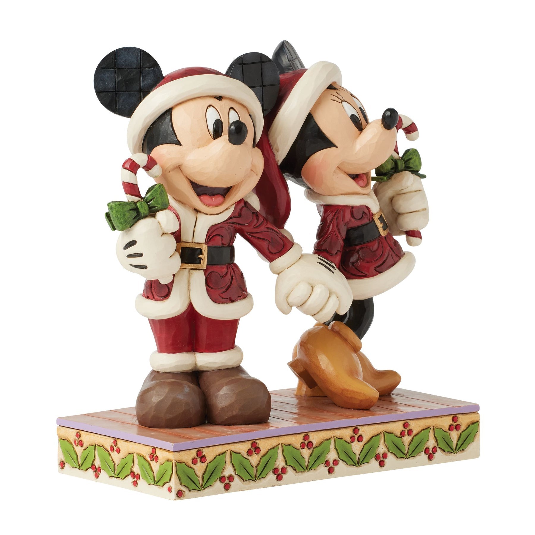 Jim Shore Mickey and Minnie Mouse figurine holding hands in matching Santa suits with candy canes
