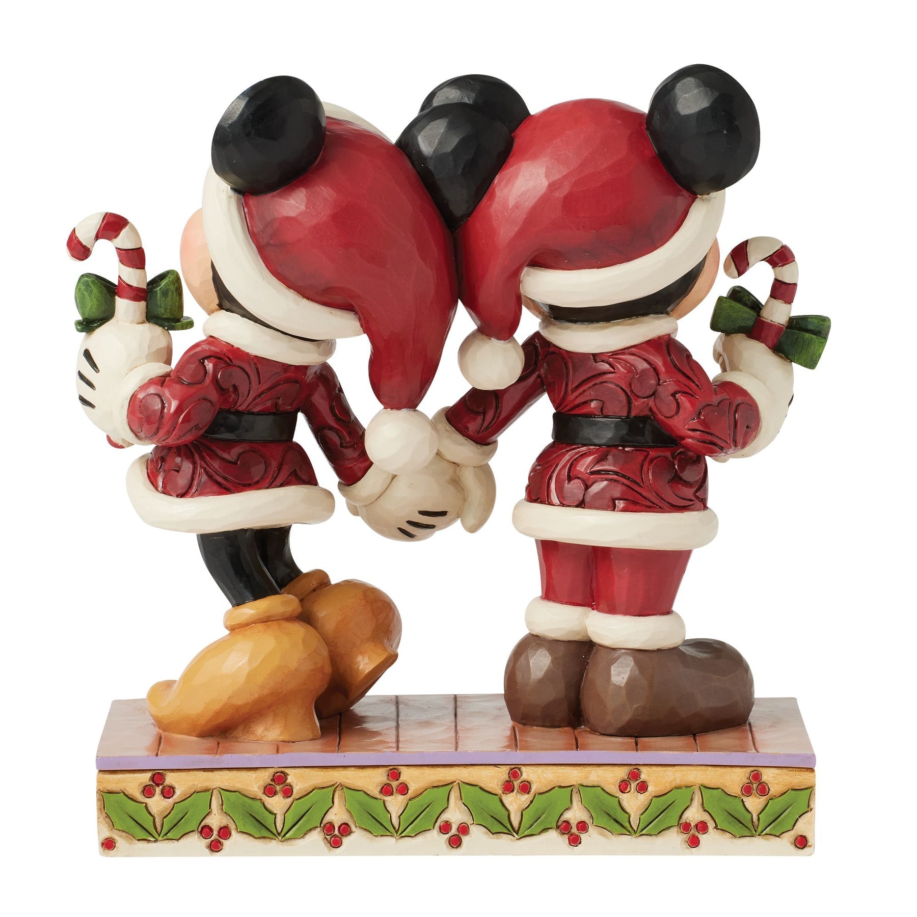 Rear view of Jim Shore Mickey and Minnie Mouse figurine showing Santa hats and holly base detail
