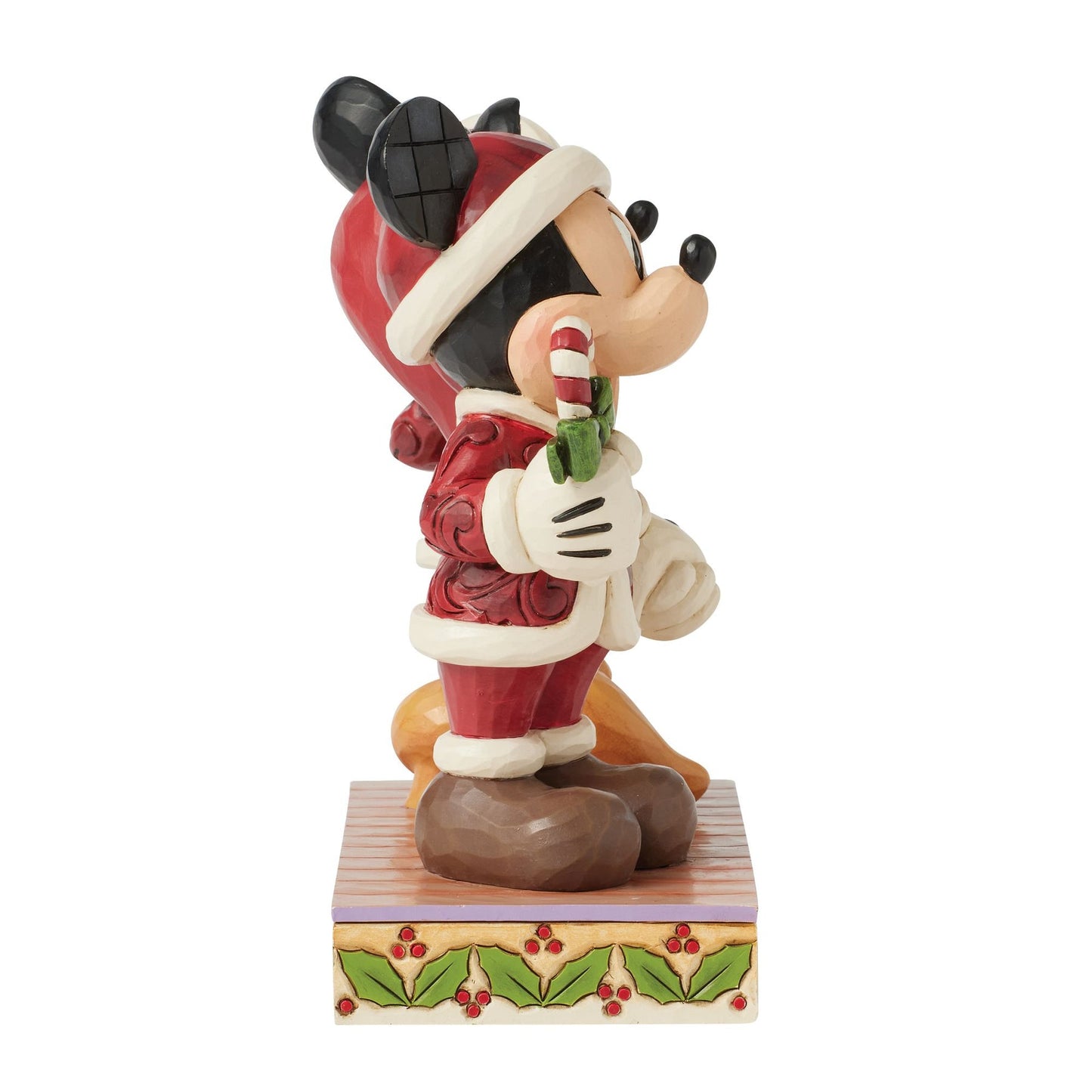 Side view of Jim Shore Mickey Mouse figurine in Santa suit holding a candy cane