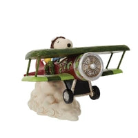 Jim Shore Snoopy Flying Ace figurine with Woodstock riding a decorated biplane over clouds

